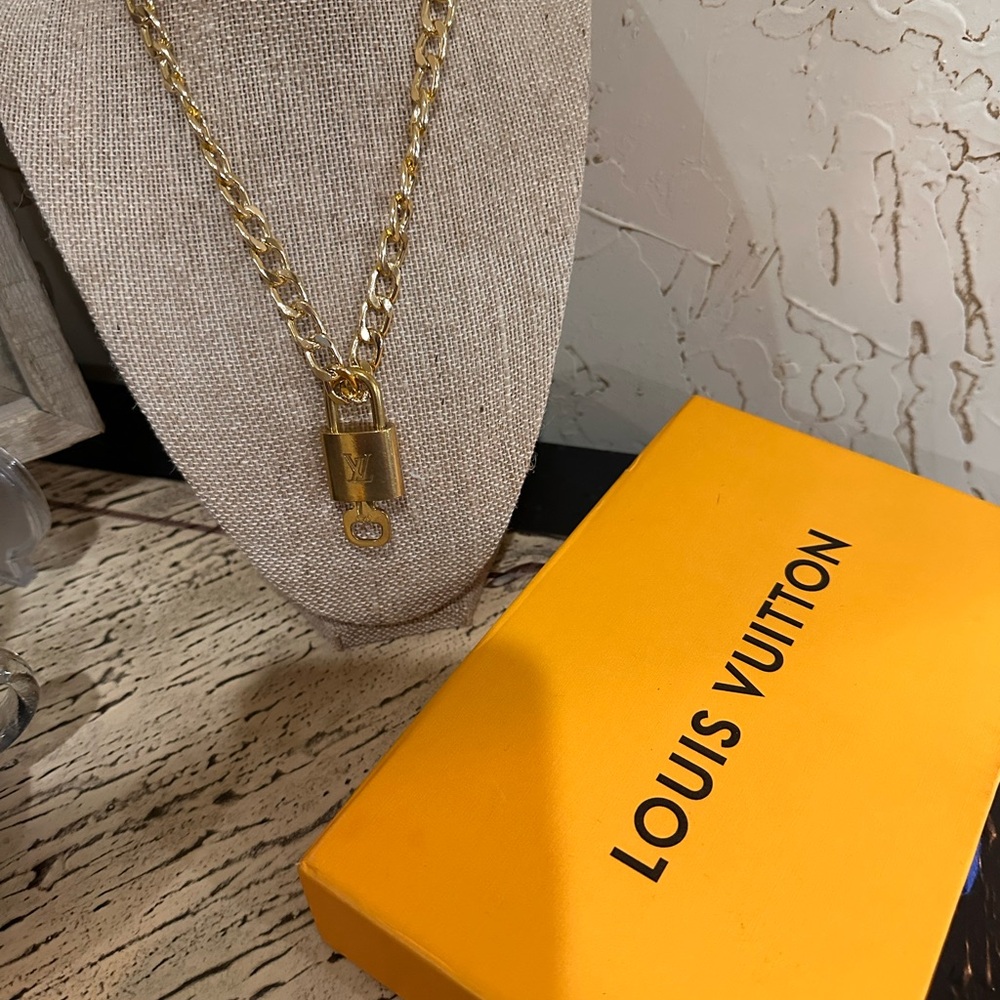 Louis Vuitton Gold Padlock authentic with fashion Necklace added. 323